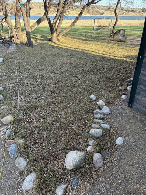 Before the spring cleanup: Lawn above the lake